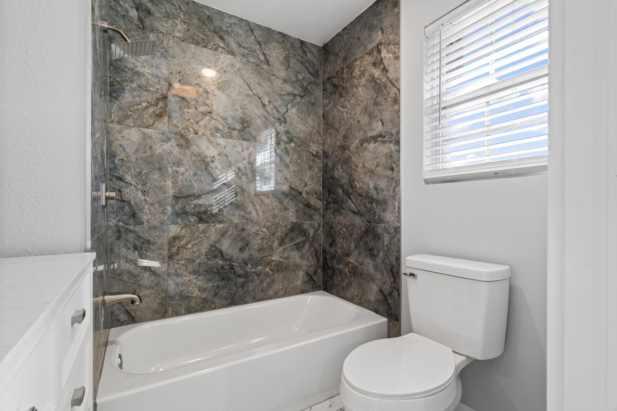 1740 6th Street Hempstead, TX 77445 - Photo 9 of 21 a white toilet sitting next to a bath tub