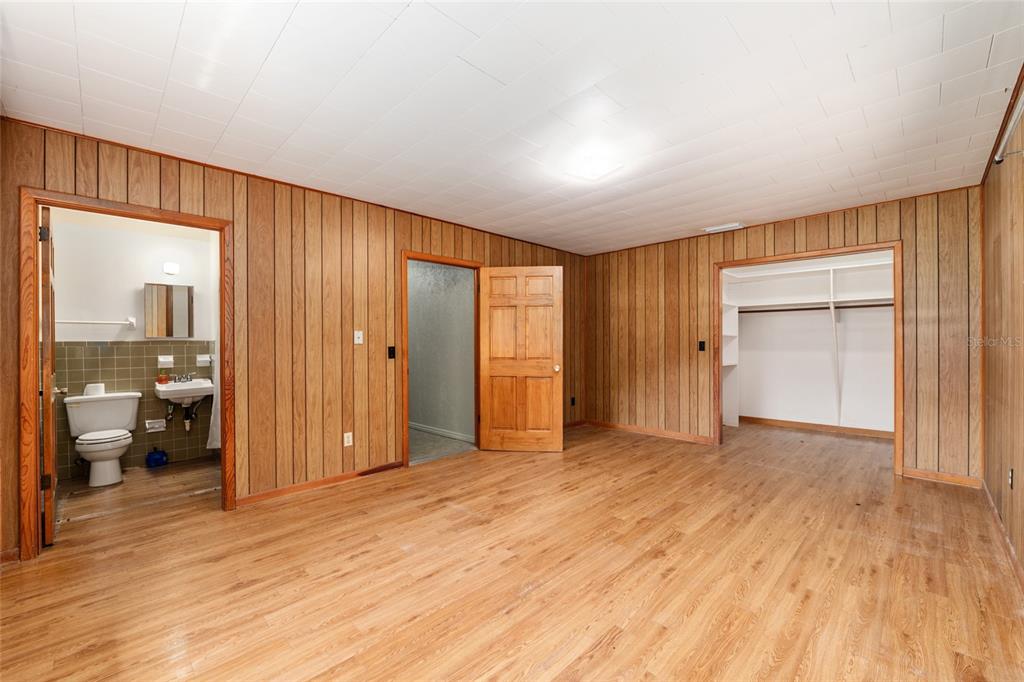 4367 Highway 301 Bushnell, FL 33513 - Photo 19 of 44 a view of empty room with wooden floor and cabinet