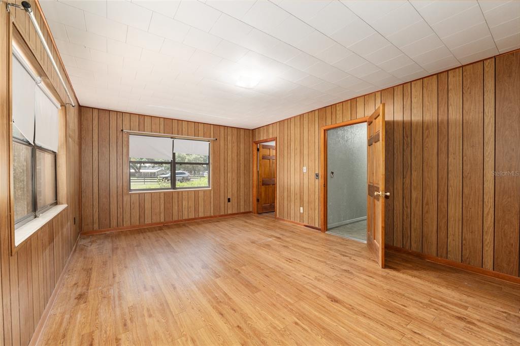 4367 Highway 301 Bushnell, FL 33513 - Photo 20 of 44 an empty room with wooden floor and windows