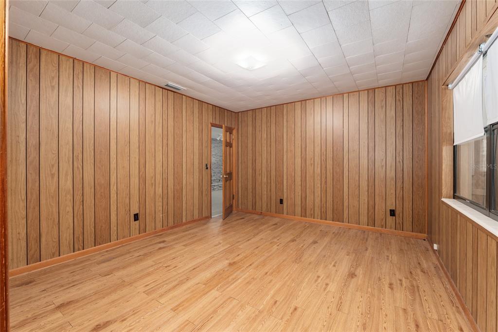 4367 Highway 301 Bushnell, FL 33513 - Photo 26 of 44 wooden floor in an empty room with a window