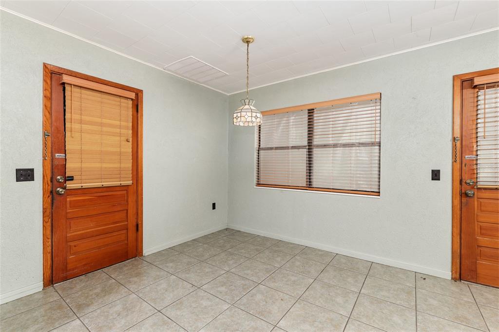 4367 Highway 301 Bushnell, FL 33513 - Photo 8 of 44 a view of an empty room with window and cabinet area