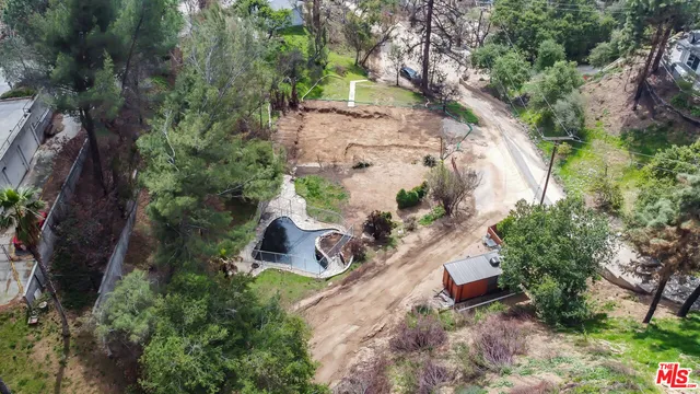 an aerial view of a house with outdoor space