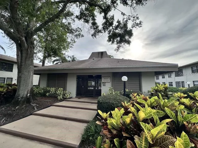 a front view of a house with lots of yellow lighting