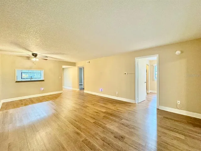 a view of a livingroom with wooden floor