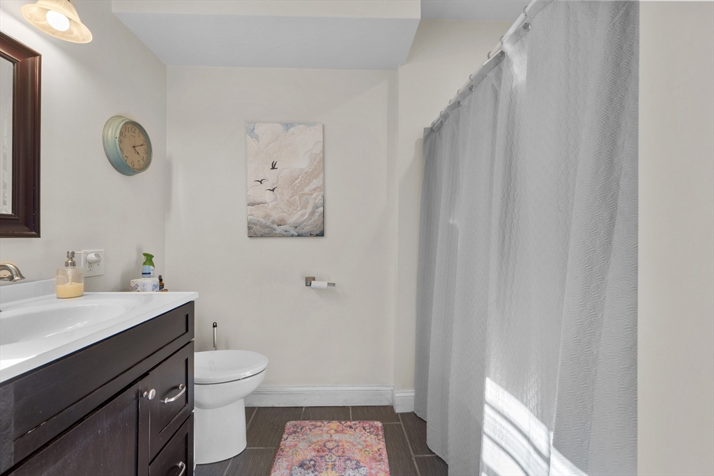 38 Brook Street Georgetown, MA 01833 - Photo 12 of 42 a bathroom with a sink a toilet and shower