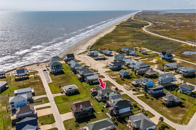 an aerial view of a house with swimming pool