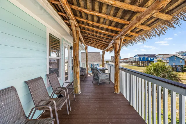 a kitchen with stainless steel appliances granite countertop a refrigerator oven a sink a stove and white cabinets with wooden floor