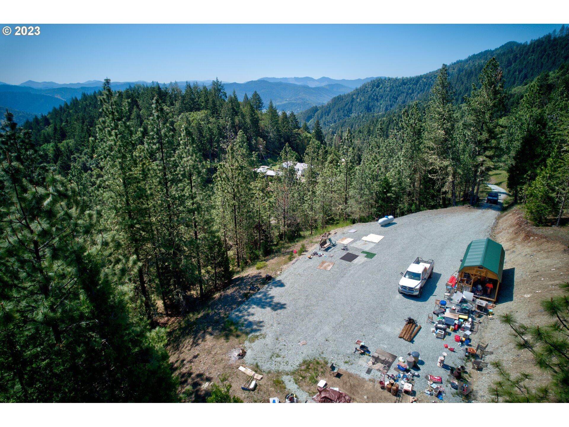 2133 Spring Brook Road Myrtle Creek, OR 97457 - Photo 21 of 33 an aerial view of a house with a yard