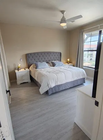 a bedroom with a bed and window