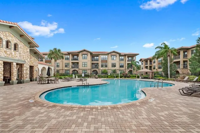 a view of a swimming pool and a chairs