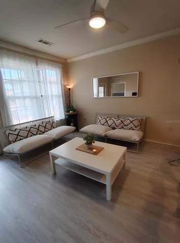 a living room with furniture and a window