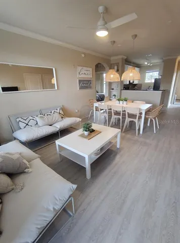 a living room with furniture and a table