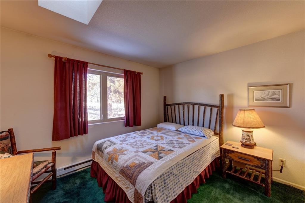 2315 Singletree Road Hartsel, CO 80449 - Photo 22 of 30 a bedroom with a bed and window