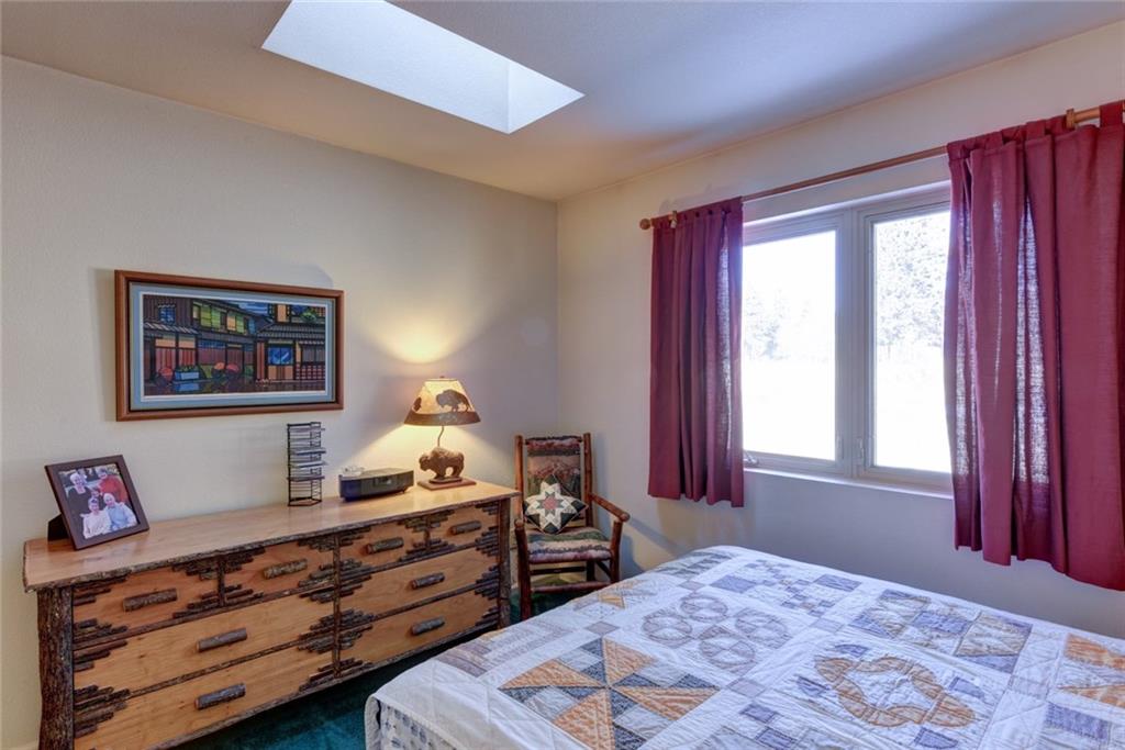 2315 Singletree Road Hartsel, CO 80449 - Photo 23 of 30 a bed room with a bed and a window