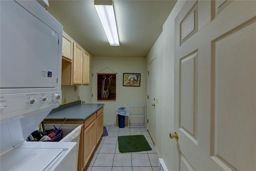 2315 Singletree Road Hartsel, CO 80449 - Photo 26 of 30 a kitchen with a refrigerator and a stove