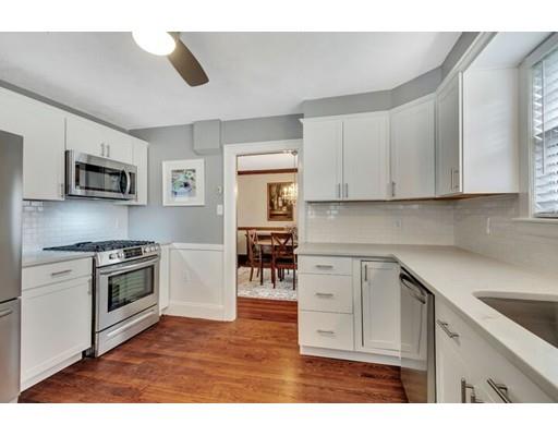 21 Homewood Road Boston, MA 02132 - Photo 15 of 25 a kitchen with stainless steel appliances granite countertop a stove top oven a sink dishwasher and white cabinets