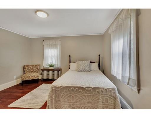 21 Homewood Road Boston, MA 02132 - Photo 19 of 25 a bedroom with a bed and wooden floor