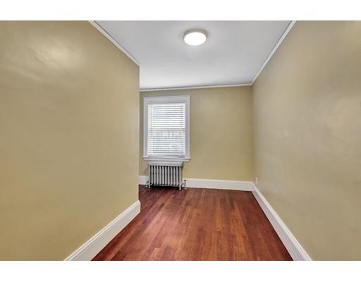 21 Homewood Road Boston, MA 02132 - Photo 20 of 25 a view of an empty room with wooden floor and a window