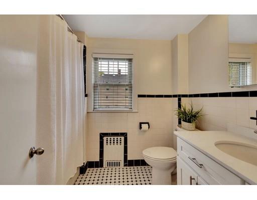 21 Homewood Road Boston, MA 02132 - Photo 21 of 25 a bathroom with a toilet a sink and a mirror