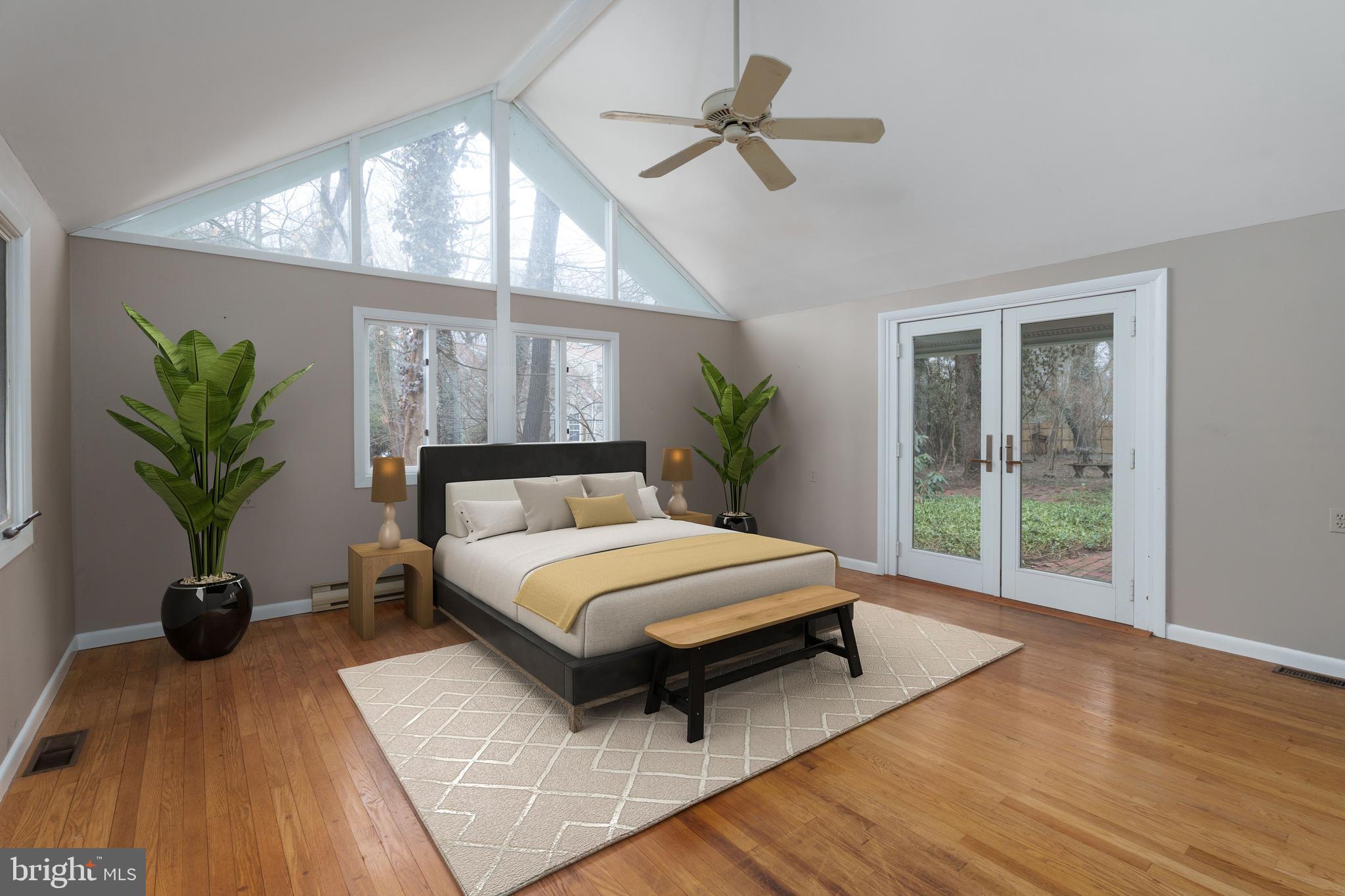 505 Prospect Avenue Princeton, NJ 08540 - Photo 16 of 28 a spacious bedroom with a large bed and a potted plant