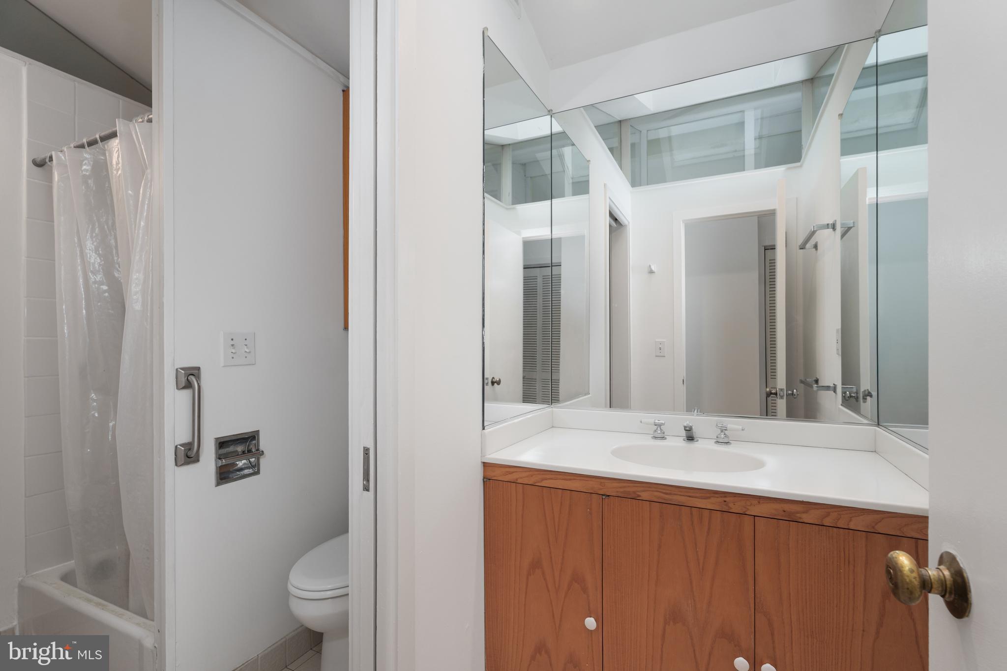 505 Prospect Avenue Princeton, NJ 08540 - Photo 22 of 28 a bathroom with a sink and a mirror