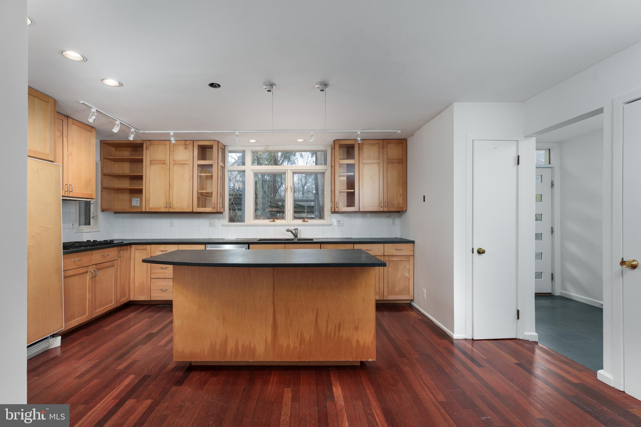 505 Prospect Avenue Princeton, NJ 08540 - Photo 4 of 28 a kitchen with stainless steel appliances granite countertop wooden floors and sink