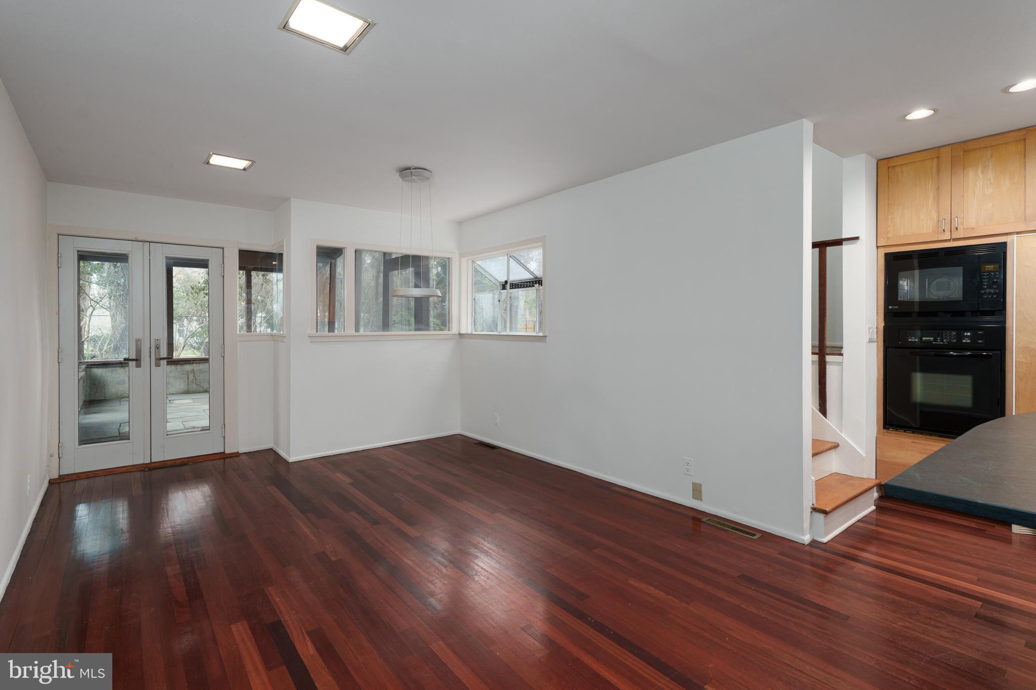 505 Prospect Avenue Princeton, NJ 08540 - Photo 7 of 28 a view of an empty room with wooden floor and a kitchen