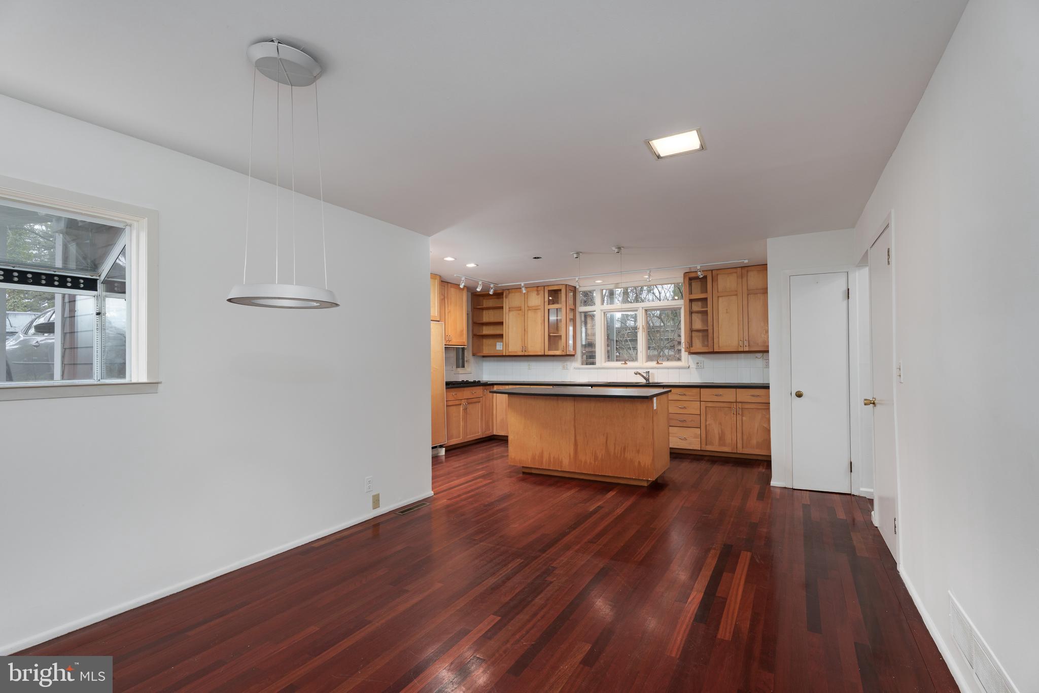 505 Prospect Avenue Princeton, NJ 08540 - Photo 9 of 28 a room with wooden floors and kitchen view