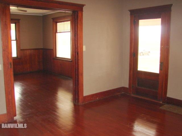 8574 North Coon Road Dakota, IL 61018 - Photo 18 of 21 an empty room with wooden floor and windows
