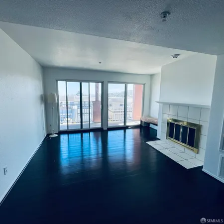 a view of livingroom with hardwood floor and fireplace