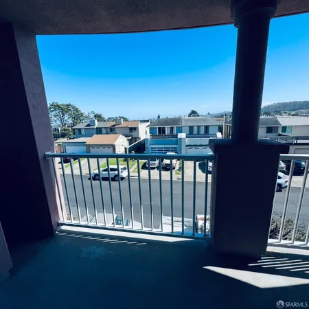 a view of a balcony with city view