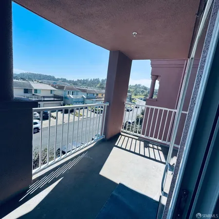 a view of balcony with furniture