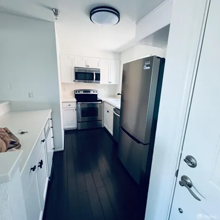 a kitchen with a refrigerator a sink and dishwasher
