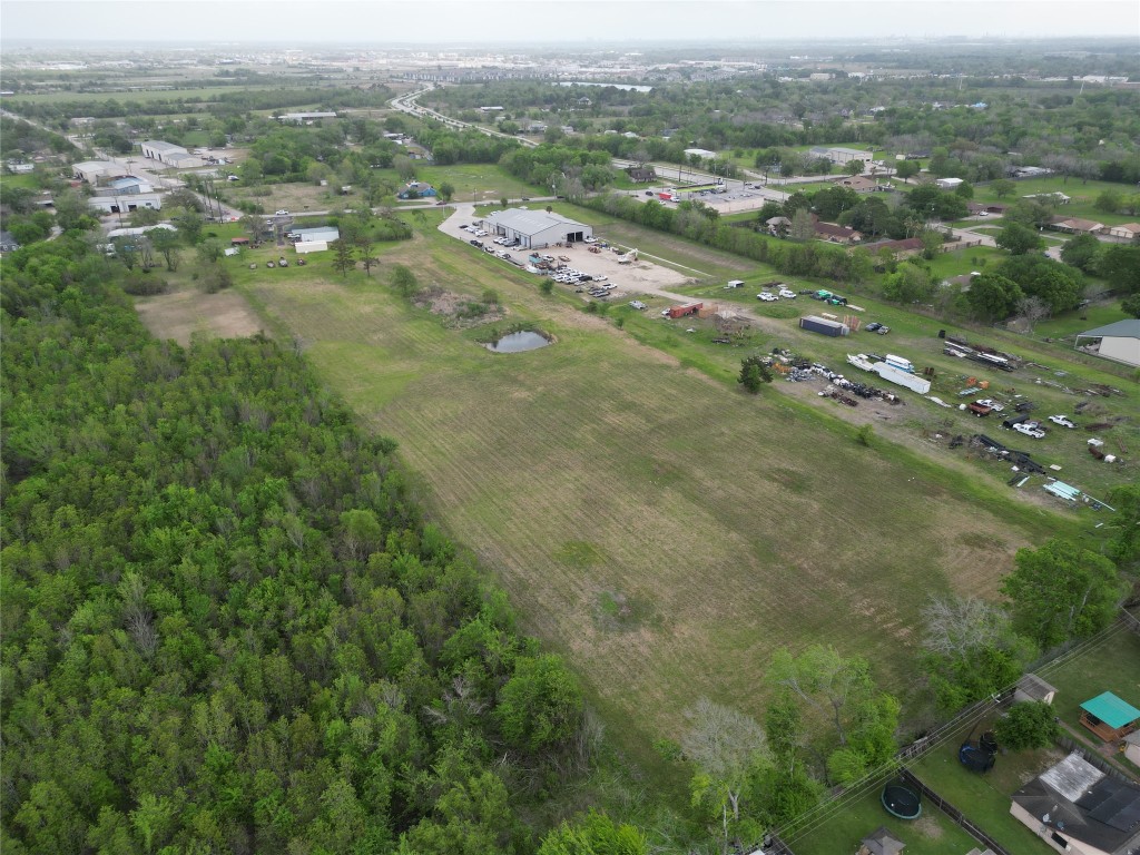2319 West Cedar Bayou Lynchburg Road Baytown, TX 77521 - Photo 4 of 6 an aerial view of residential houses with outdoor space and trees