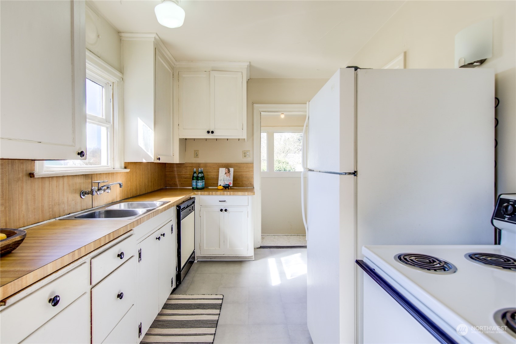 2018 11th Street Bremerton, WA 98337 - Photo 16 of 35 a kitchen with stainless steel appliances a refrigerator sink and cabinets