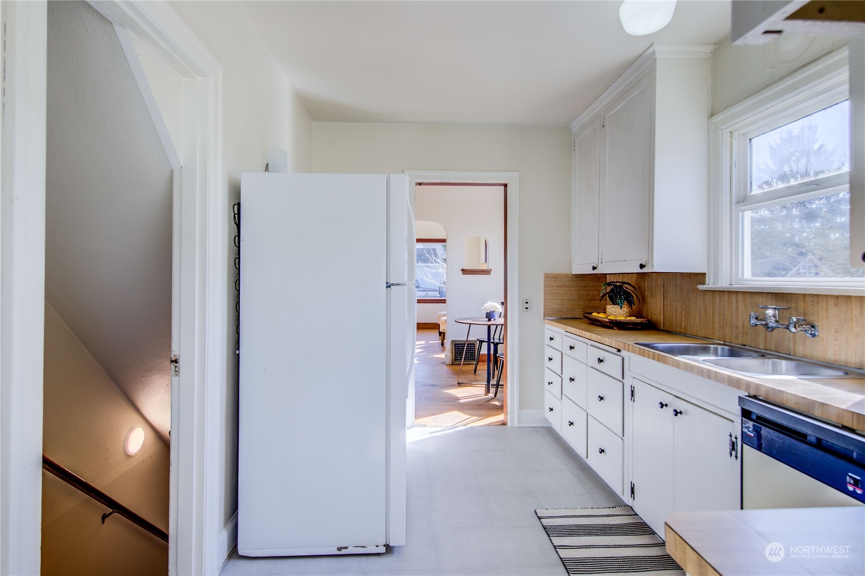 2018 11th Street Bremerton, WA 98337 - Photo 17 of 35 a kitchen with granite countertop cabinets a sink and a window