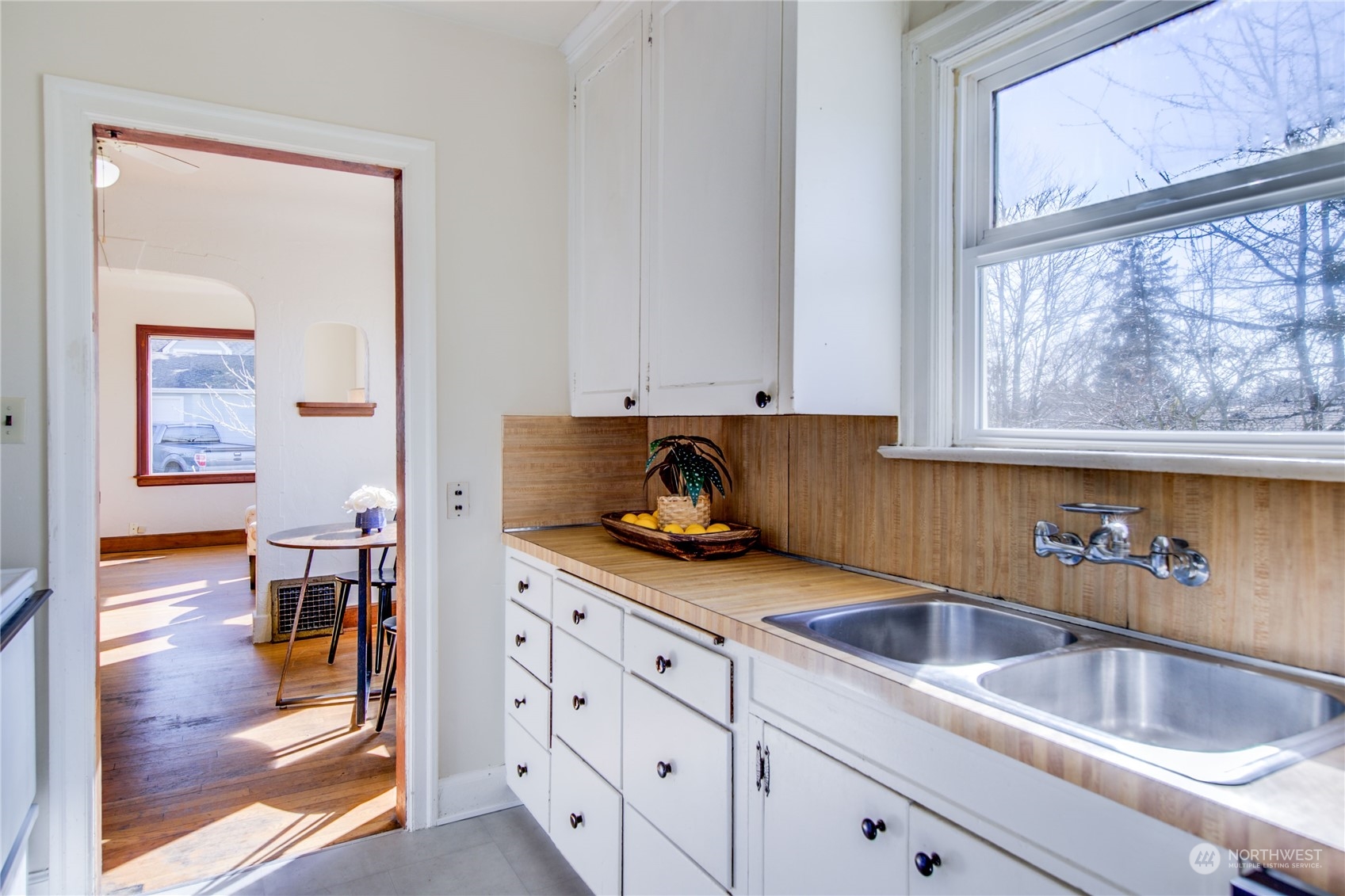 2018 11th Street Bremerton, WA 98337 - Photo 18 of 35 a kitchen with stainless steel appliances granite countertop a sink and a white wooden cabinets
