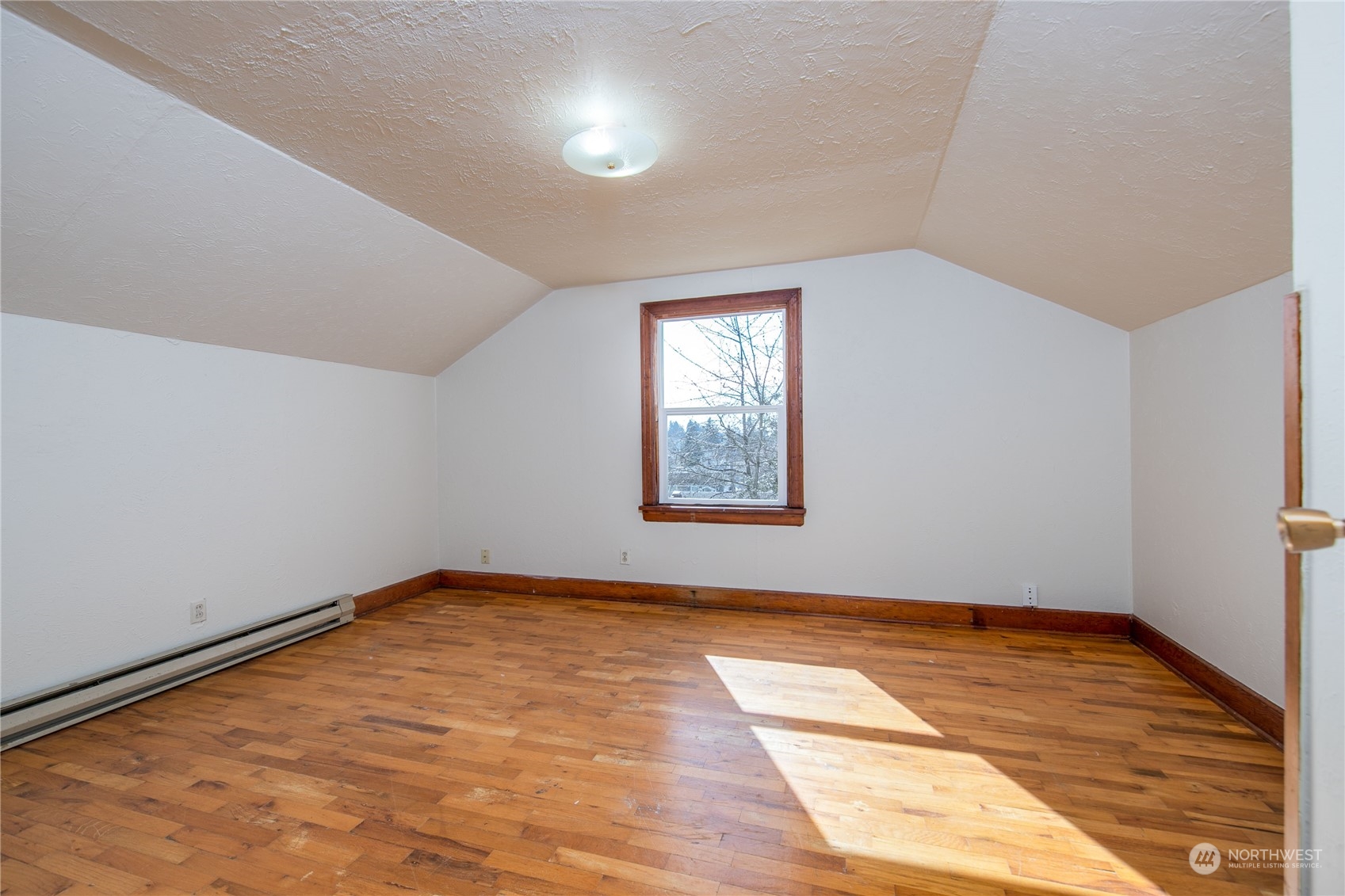 2018 11th Street Bremerton, WA 98337 - Photo 23 of 35 an empty room with wooden floor and windows