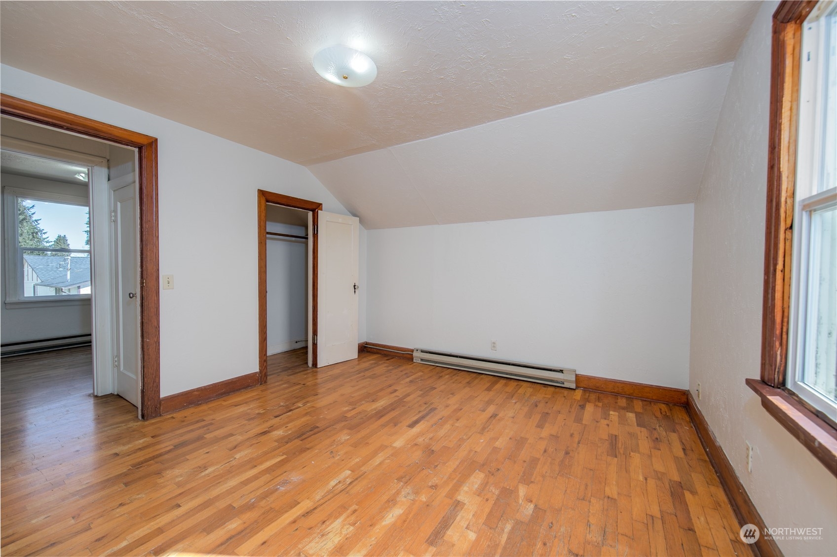 2018 11th Street Bremerton, WA 98337 - Photo 24 of 35 an empty room with wooden floor and windows