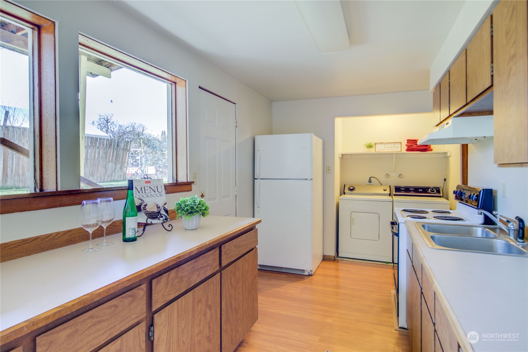 2018 11th Street Bremerton, WA 98337 - Photo 29 of 35 a kitchen with refrigerator and cabinets