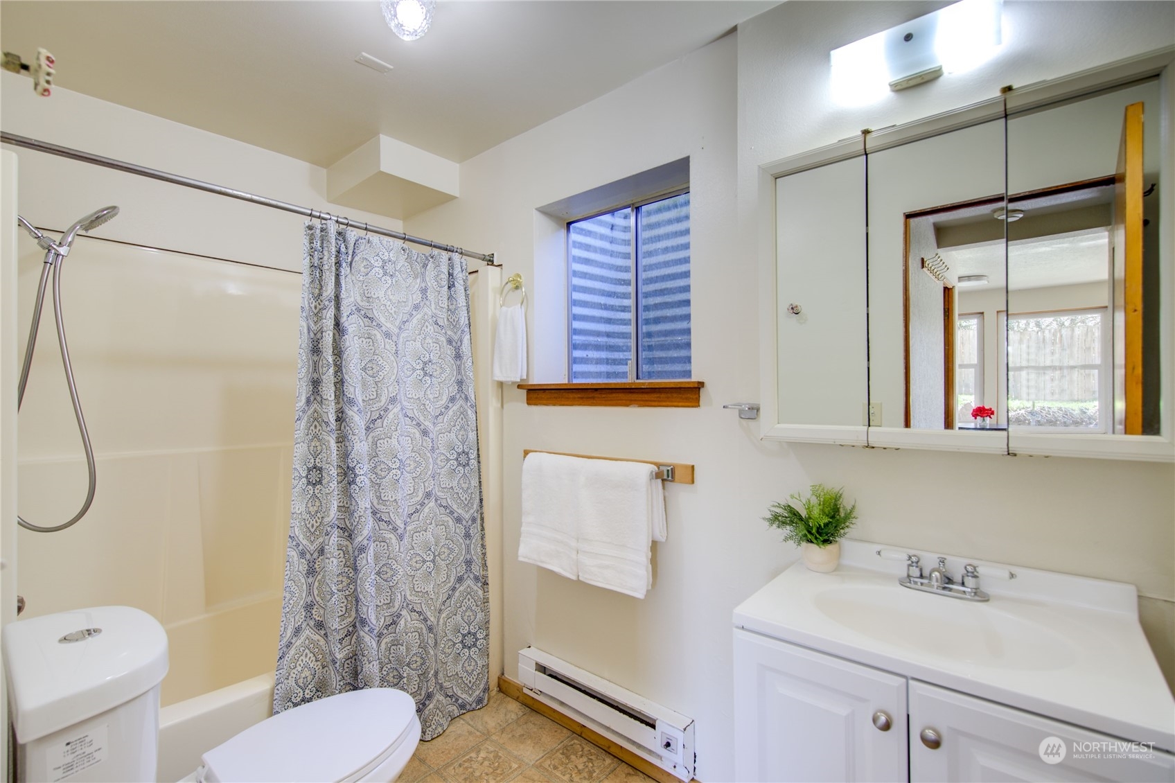 2018 11th Street Bremerton, WA 98337 - Photo 32 of 35 a bathroom with a sink toilet and shower