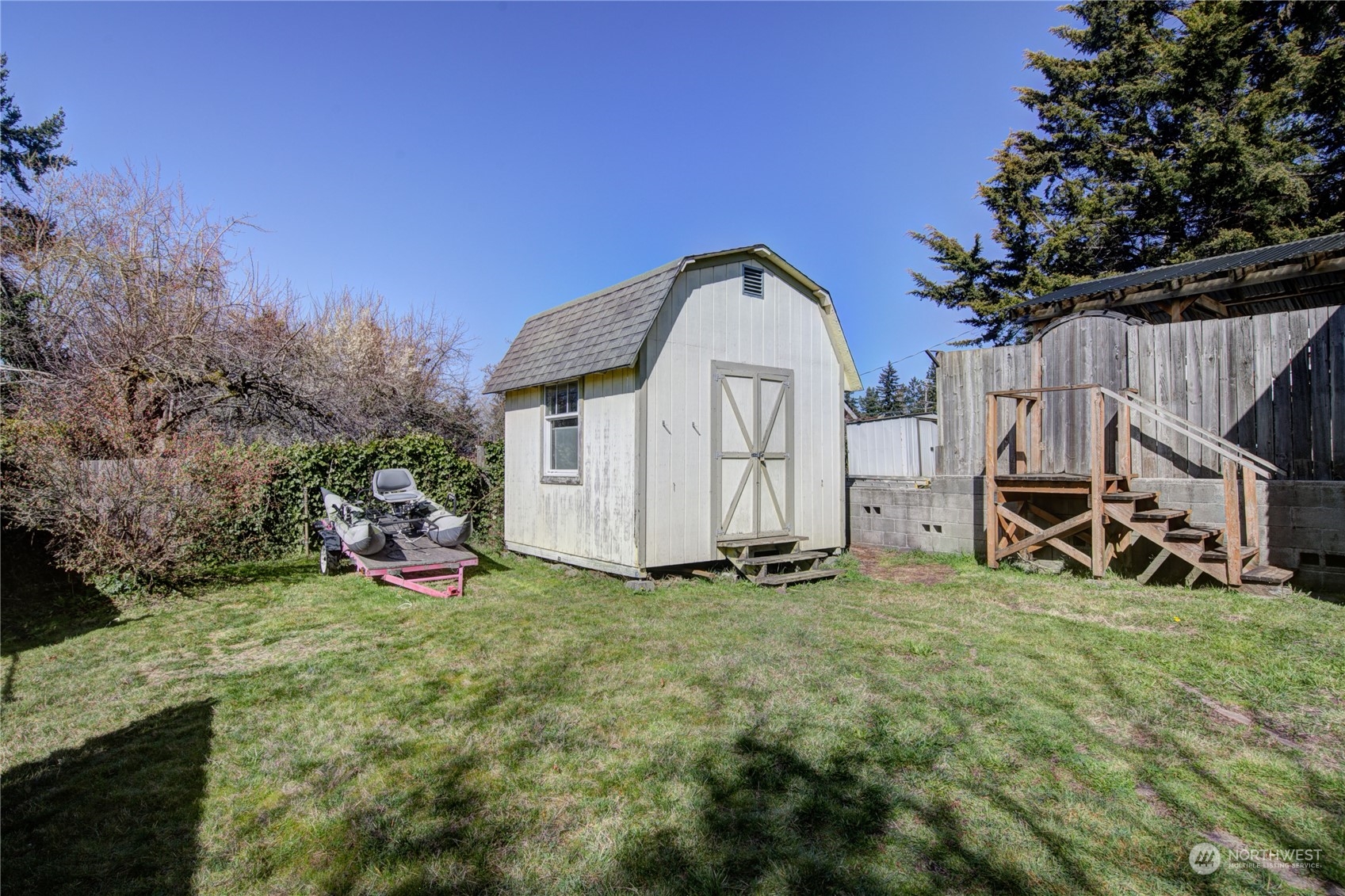 2018 11th Street Bremerton, WA 98337 - Photo 34 of 35 a view of a house with backyard and trees