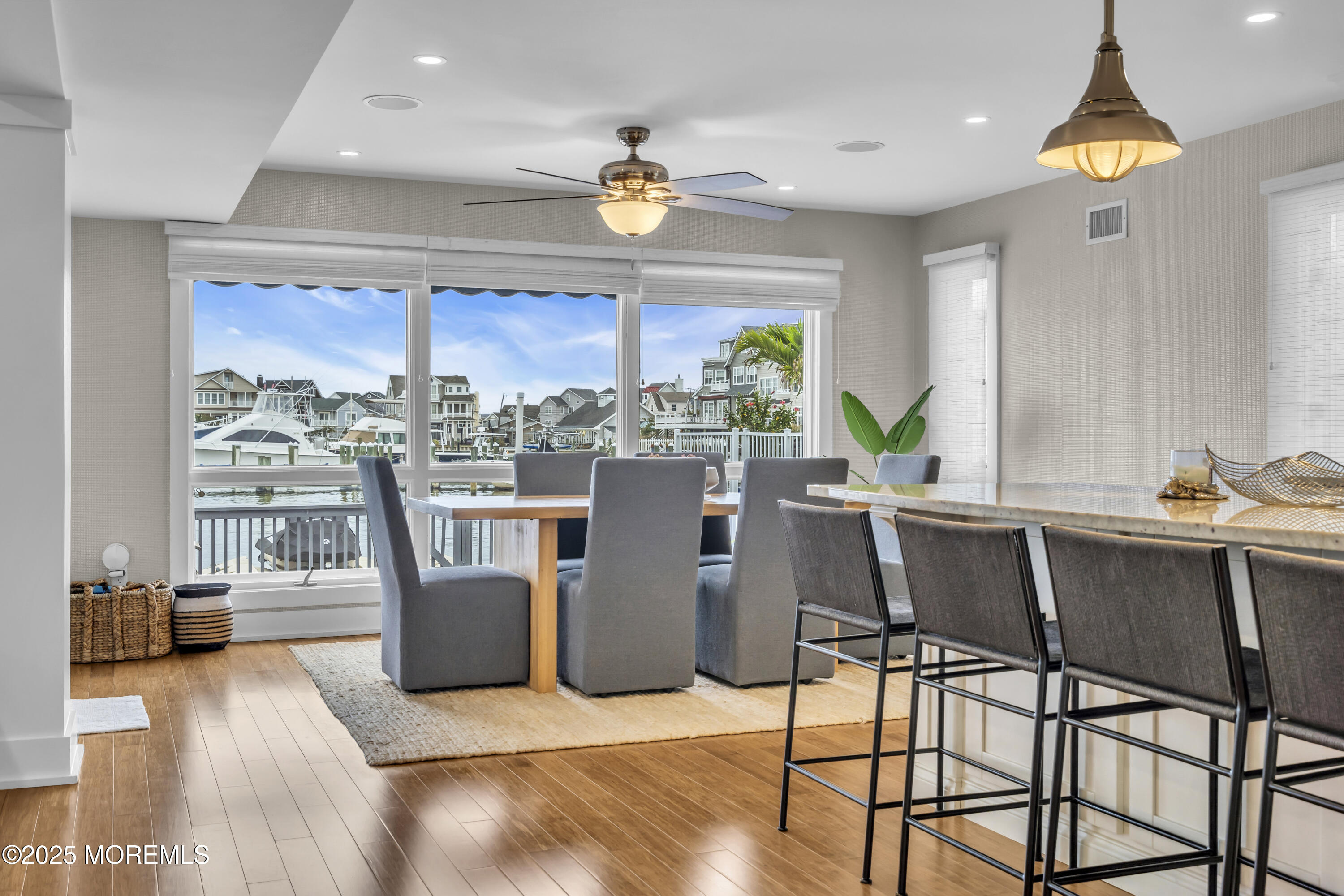 254 Harbor Court Lavallette, NJ 08735 - Photo 12 of 44 a dining room with furniture and a chandelier