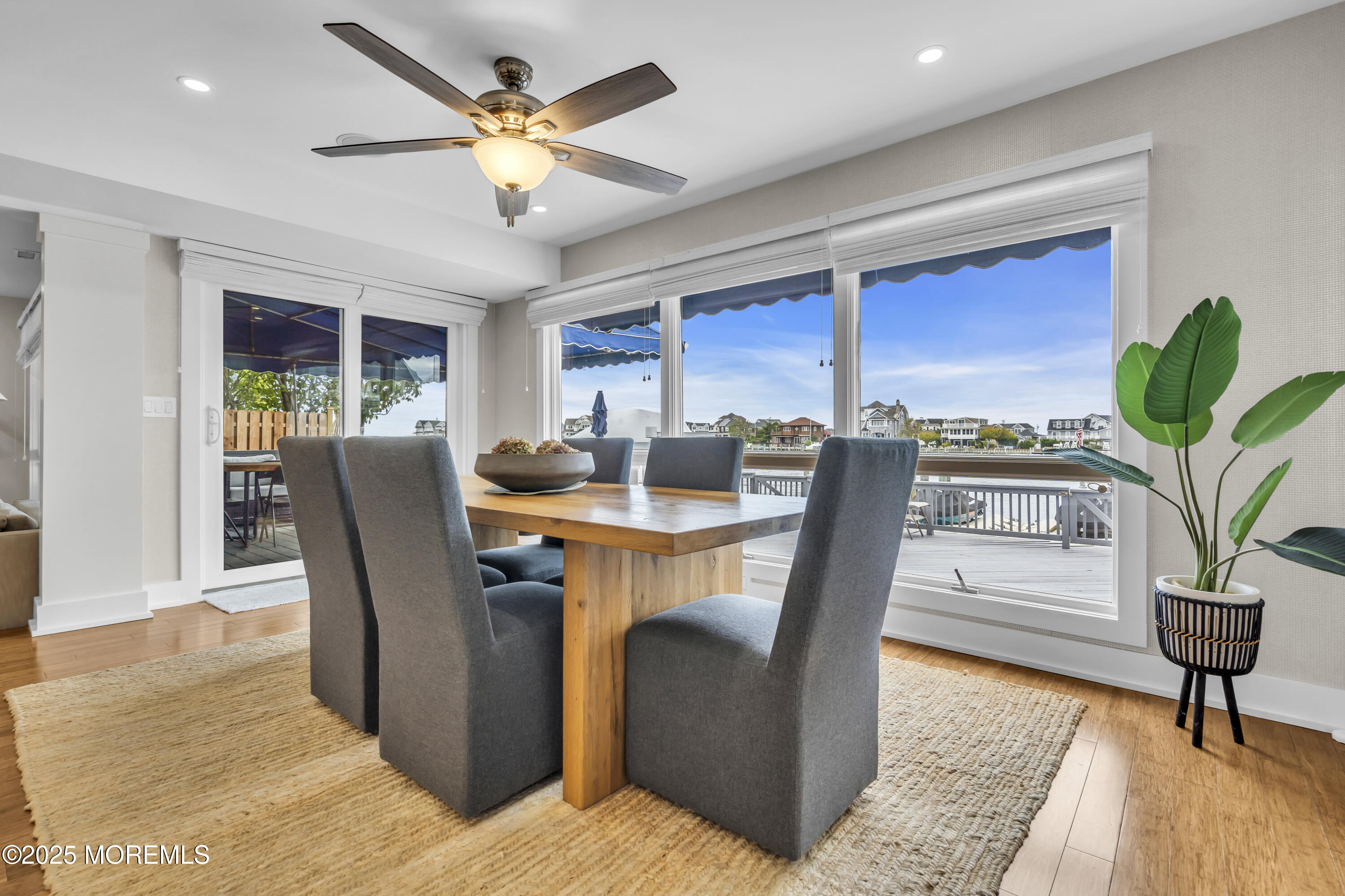254 Harbor Court Lavallette, NJ 08735 - Photo 13 of 44 a dining room with furniture a potted plant and a rug