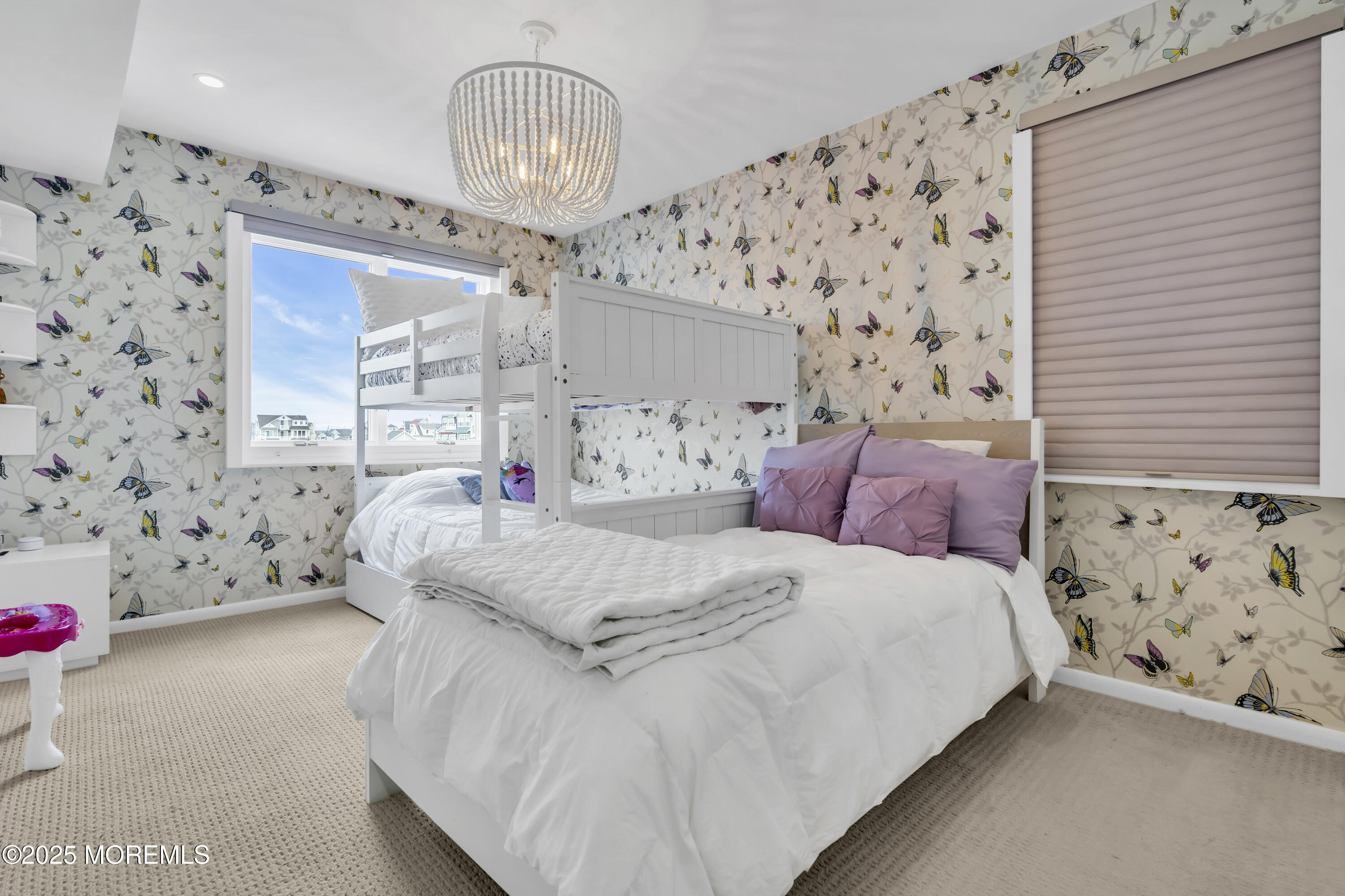 254 Harbor Court Lavallette, NJ 08735 - Photo 24 of 44 a bed room with a bed and a chandelier