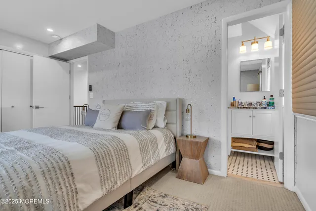 a bedroom with bed and window