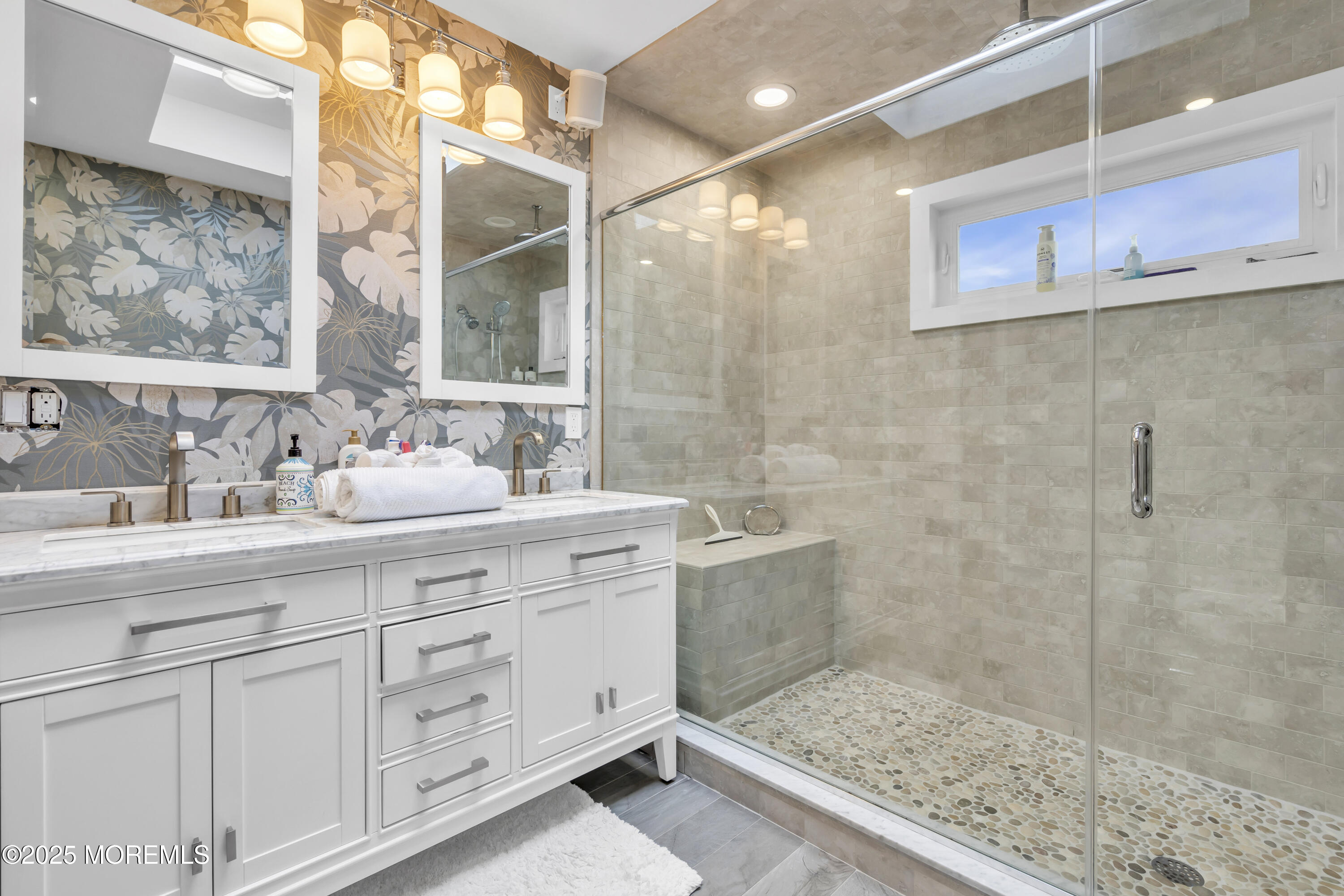 254 Harbor Court Lavallette, NJ 08735 - Photo 31 of 44 a bathroom with a shower sink and mirror