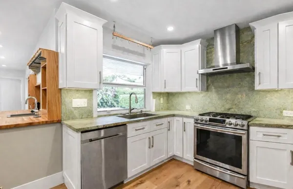 a bathroom with a double vanity sink mirror and double