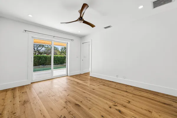 a spacious bathroom with a double sink shower and a mirror