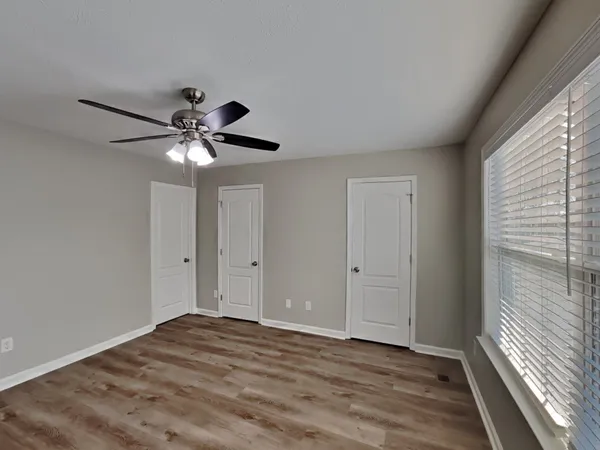 a view of room window and wooden floor